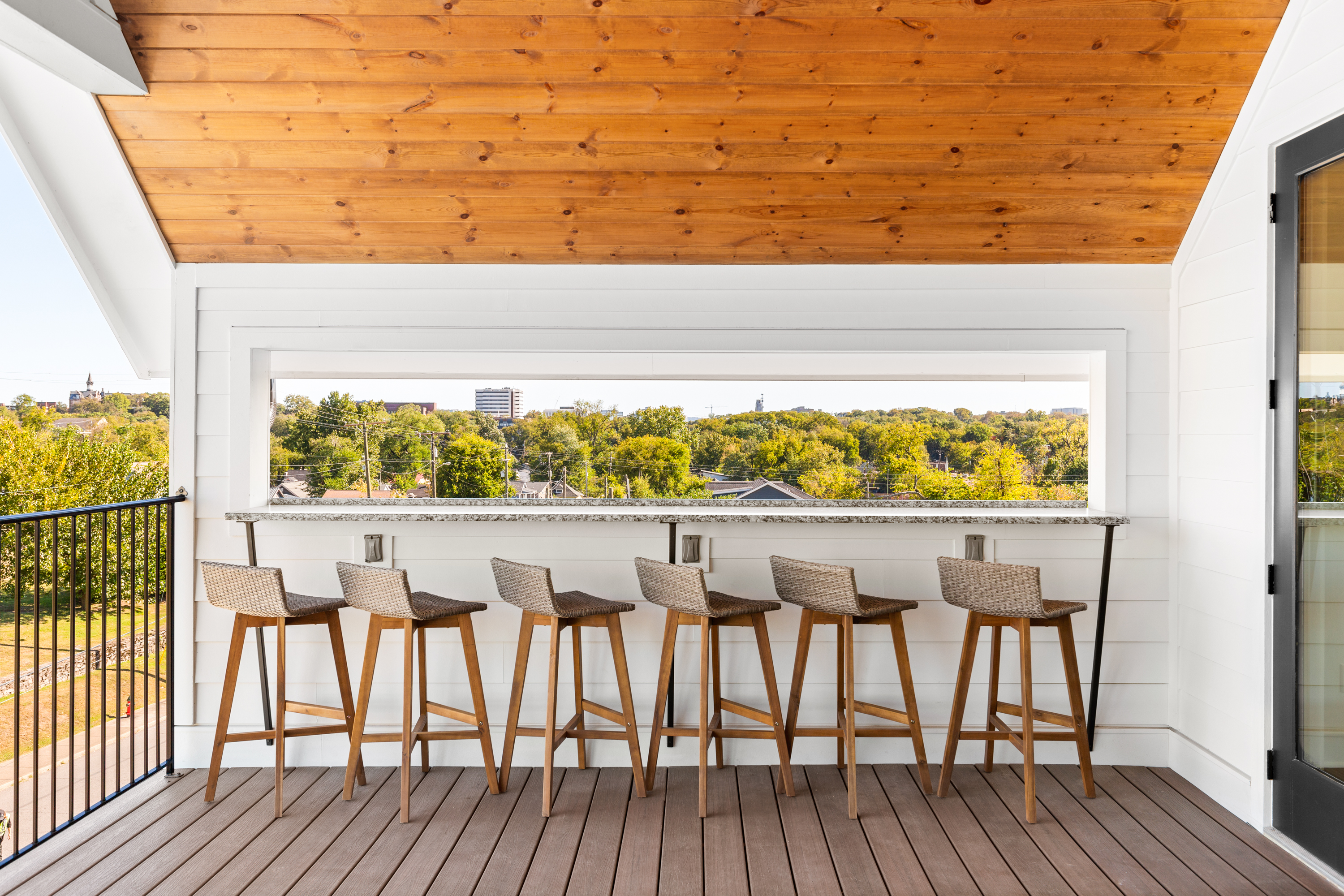 Scenic outdoor seating with wooden ceiling and panoramic views
